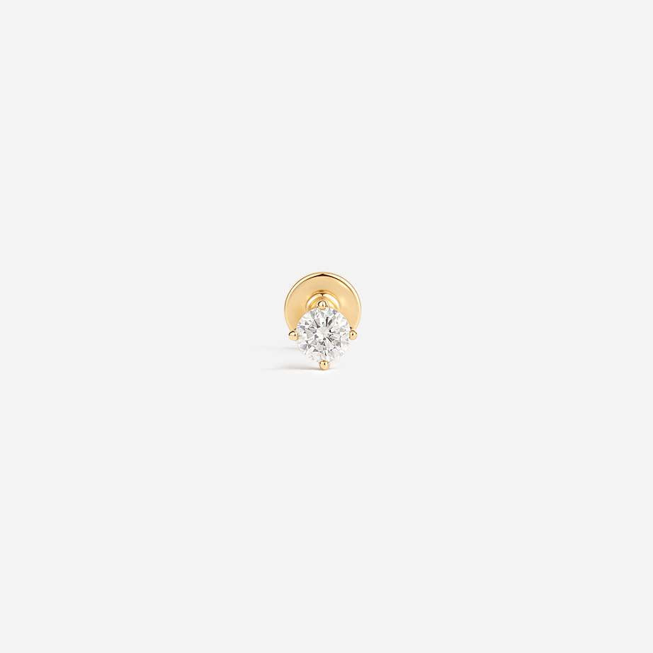 14K gold flatback piercing with a clear cubic zirconia in a prong setting, front view