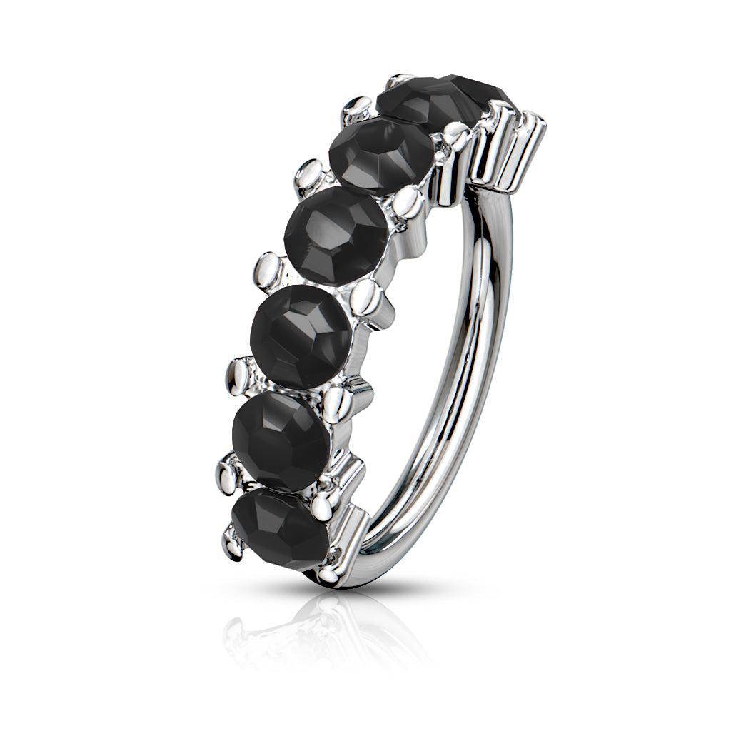Bendable steel hoop ring with seven black faceted gems and silver prongs