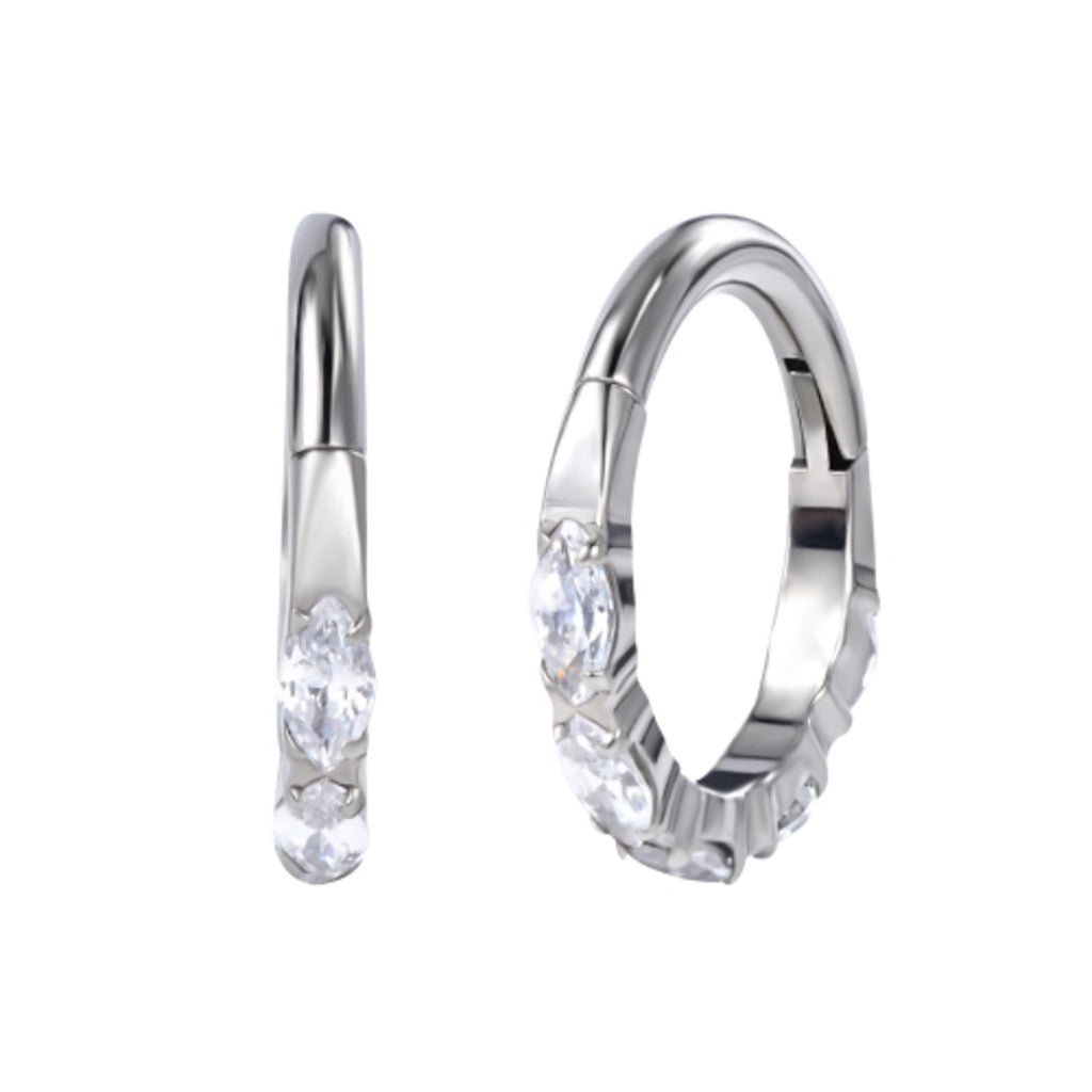 Gold-tone implant-grade titanium hinged hoop featuring clear cubic zirconia stones set along the front, shown in side and front views on a white background.