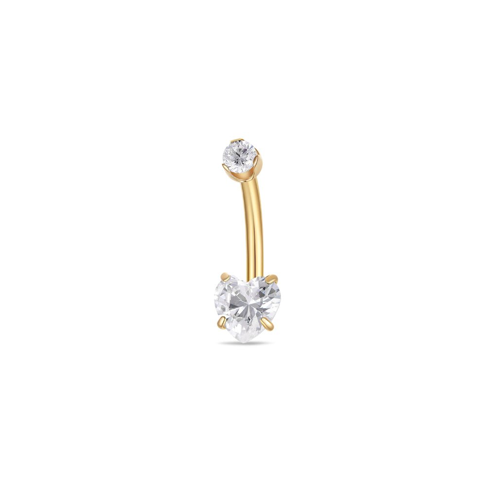 Titanium navel bar with heart-shaped clear cubic zirconia in a claw arc setting, gold tone, shown on a white background.