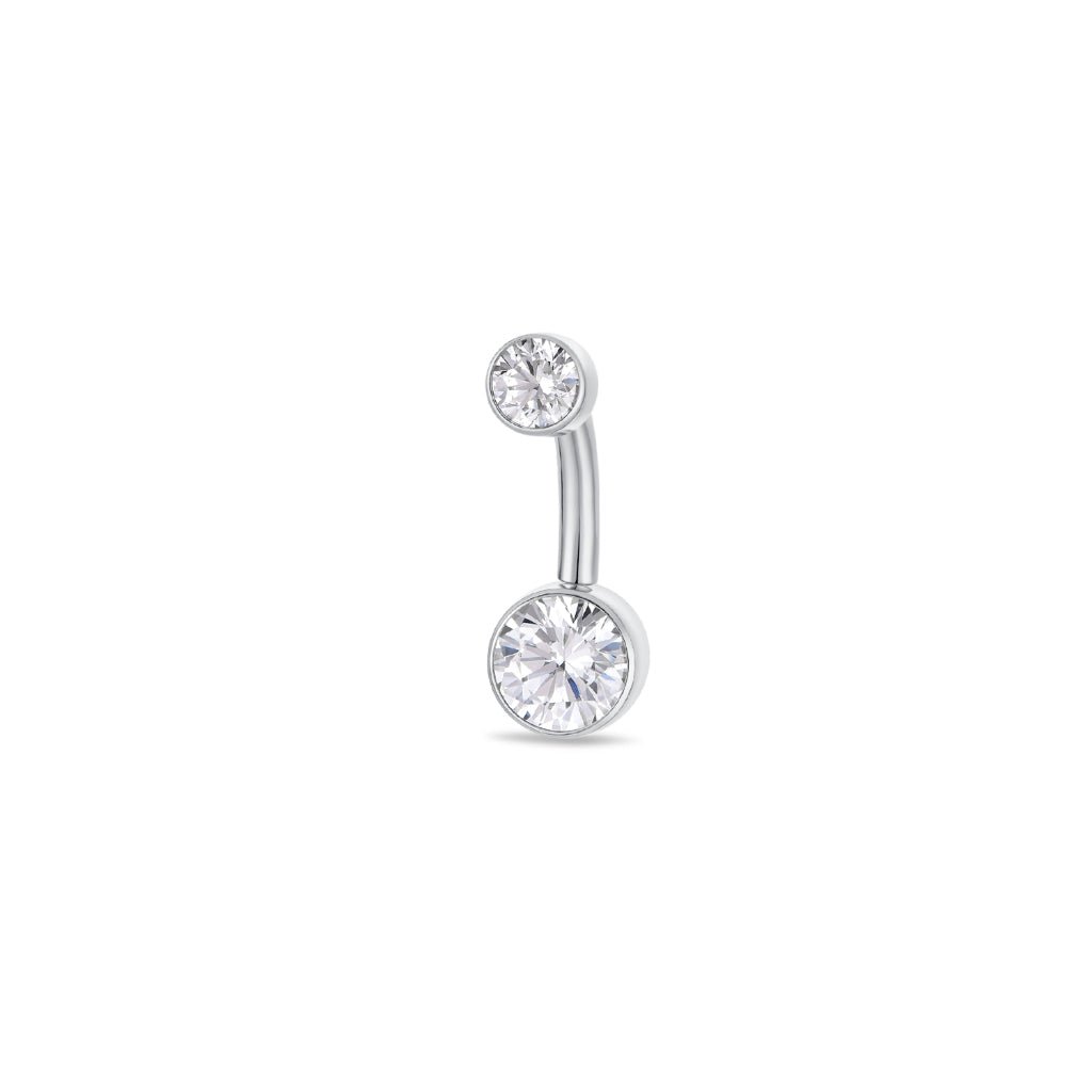 Titanium navel bar with round bezel-set clear cubic zirconia in silver tone, implant grade titanium body, studio product image.