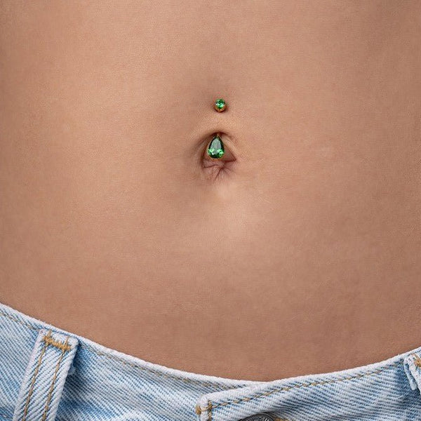 Implant Grade Titanium Navel Bar with Teardrop Cubic Zirconia in Claw Arc Setting - Gold Tone Emerald - SkinKandy | Body Jewellery & Piercing