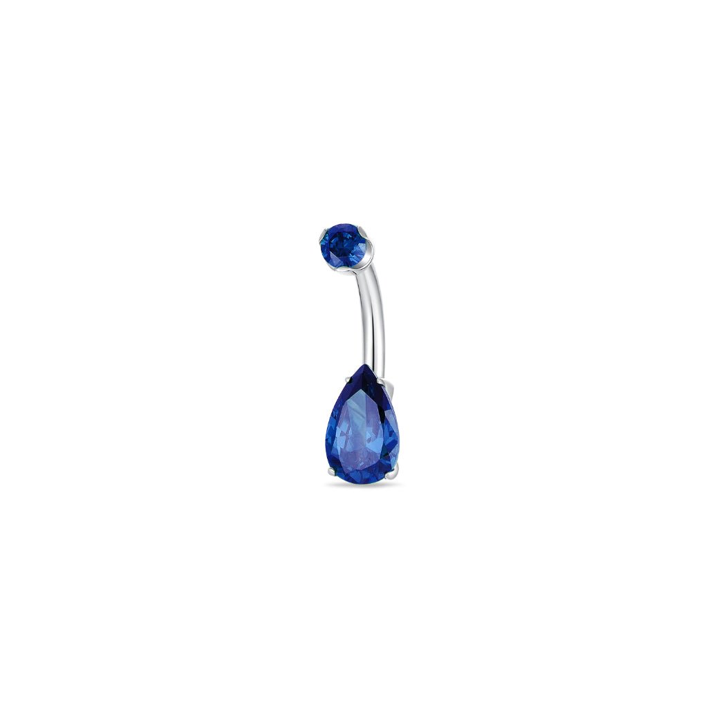 Titanium navel bar with teardrop blue cubic zirconia in a claw arc setting, gold-tone finish, shown on a white background