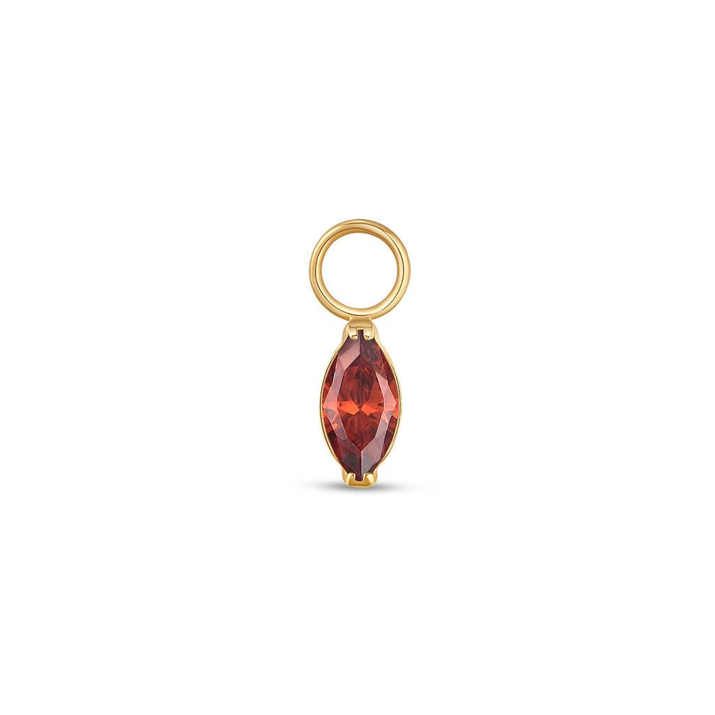 Gold-tone titanium marquis red cubic zirconia charm with jump ring.