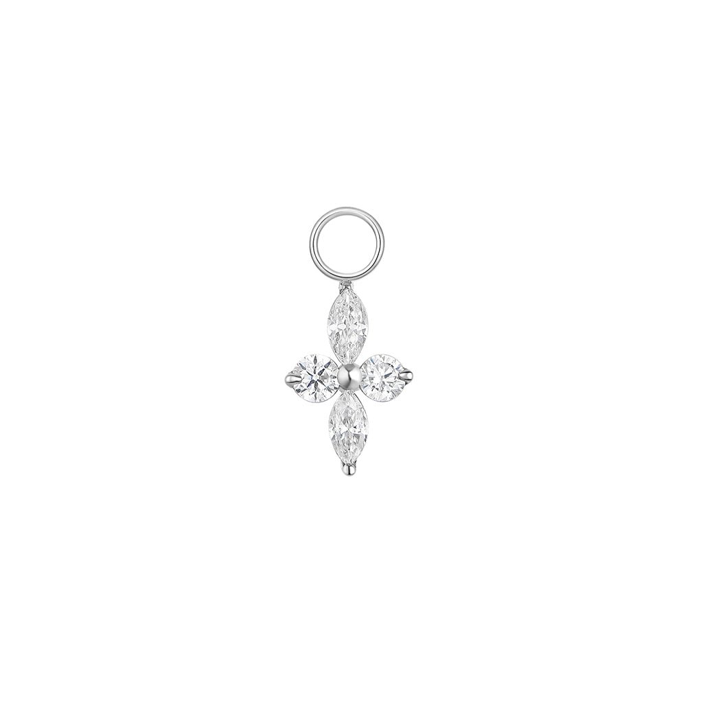 Silver-tone titanium four-point star charm with marquise and round cubic zirconia stones and jump ring.
