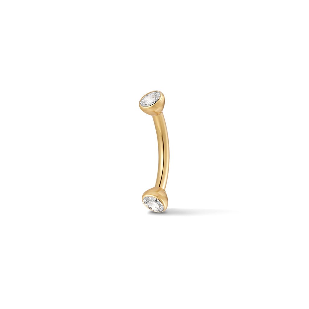 Gold-tone bezel-set cubic zirconia curved barbell piercing