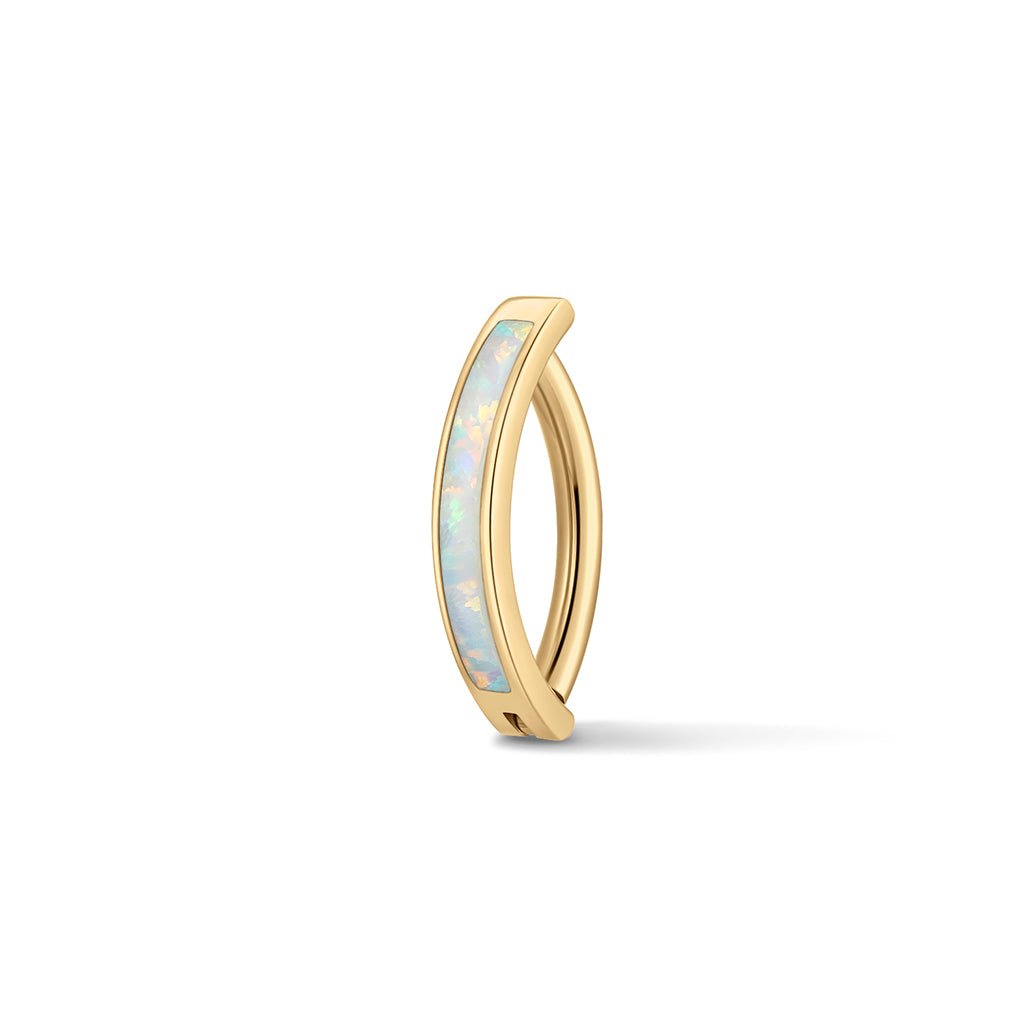 Gold-tone navel clicker with opalescent inset detail