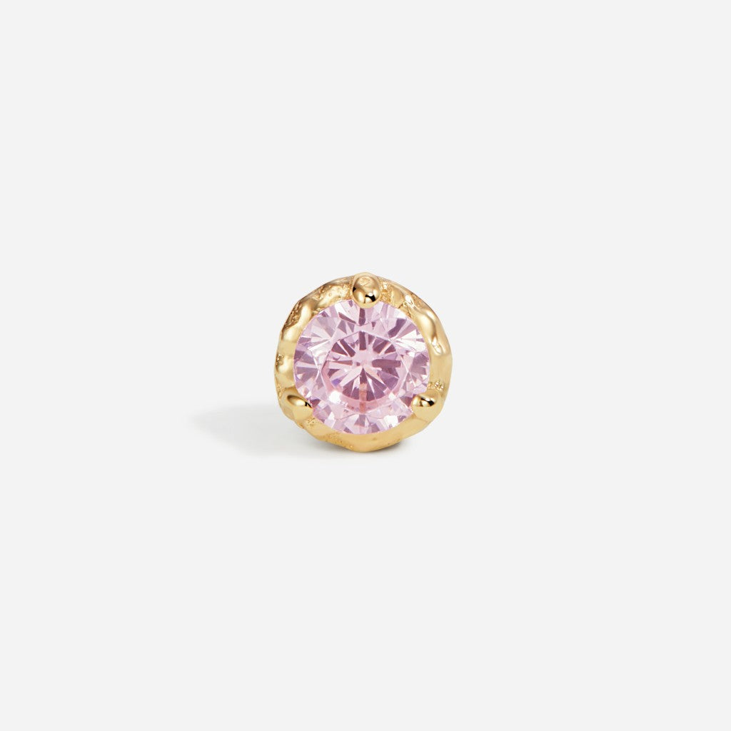 Gold bezel-set flatback stud featuring a round pink cubic zirconia stone in a classic minimalist design.