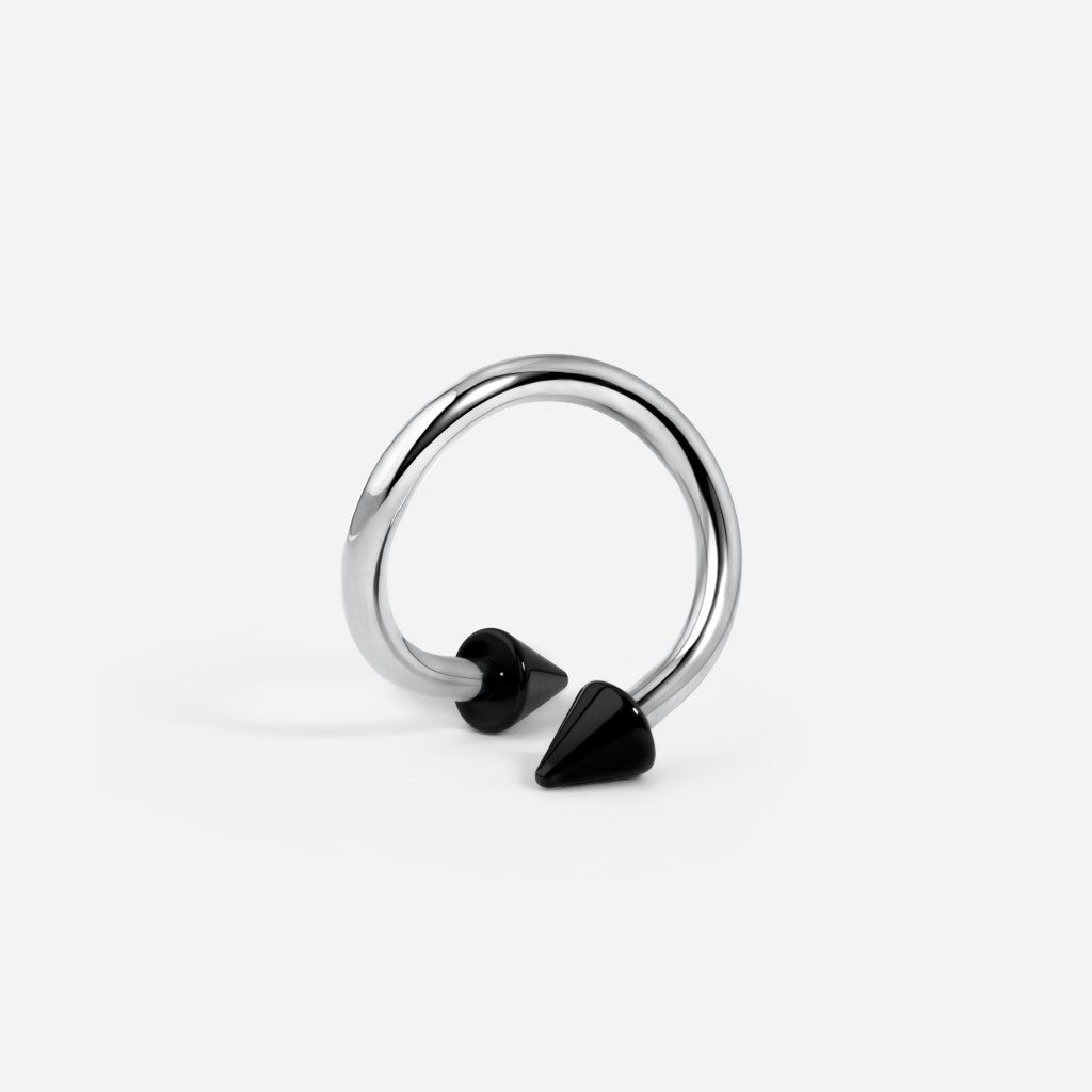 Silver and black tone titanium internally threaded black spike horseshoe.
