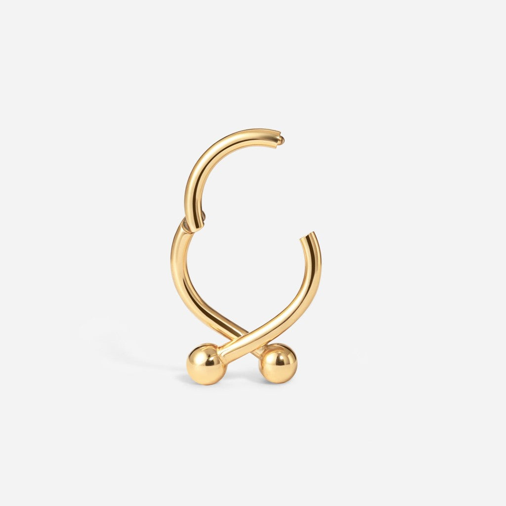 Gold stainless steel twister ball segment ring.
