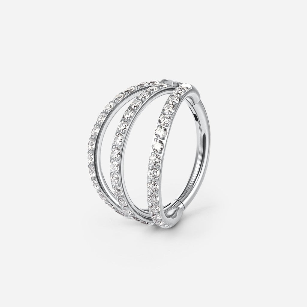 Silver titanium cubic zirconia triple hoop segment ring.
