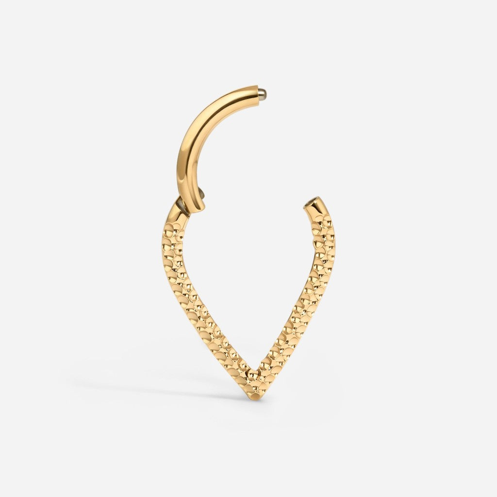 Gold titanium hammered v-shape segment ring.
