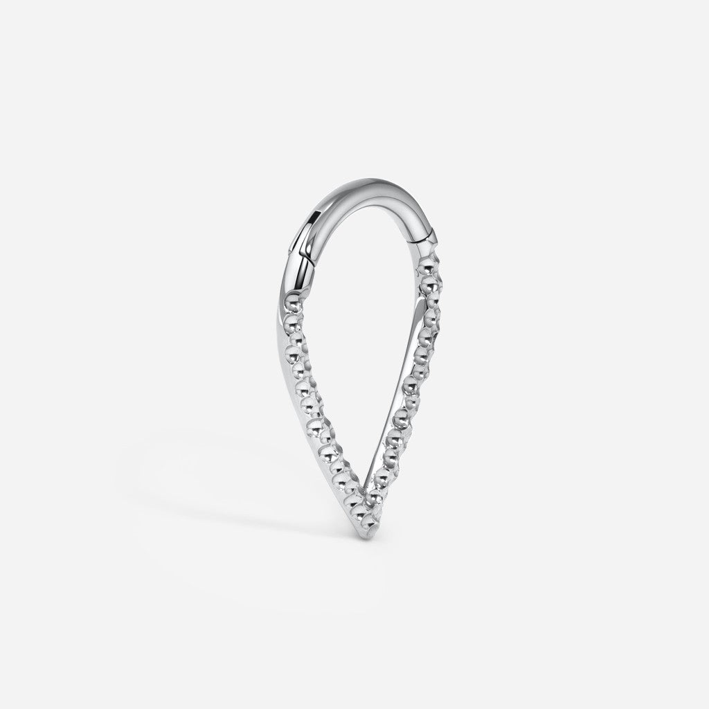 Silver titanium hammered v-shape segment ring.
