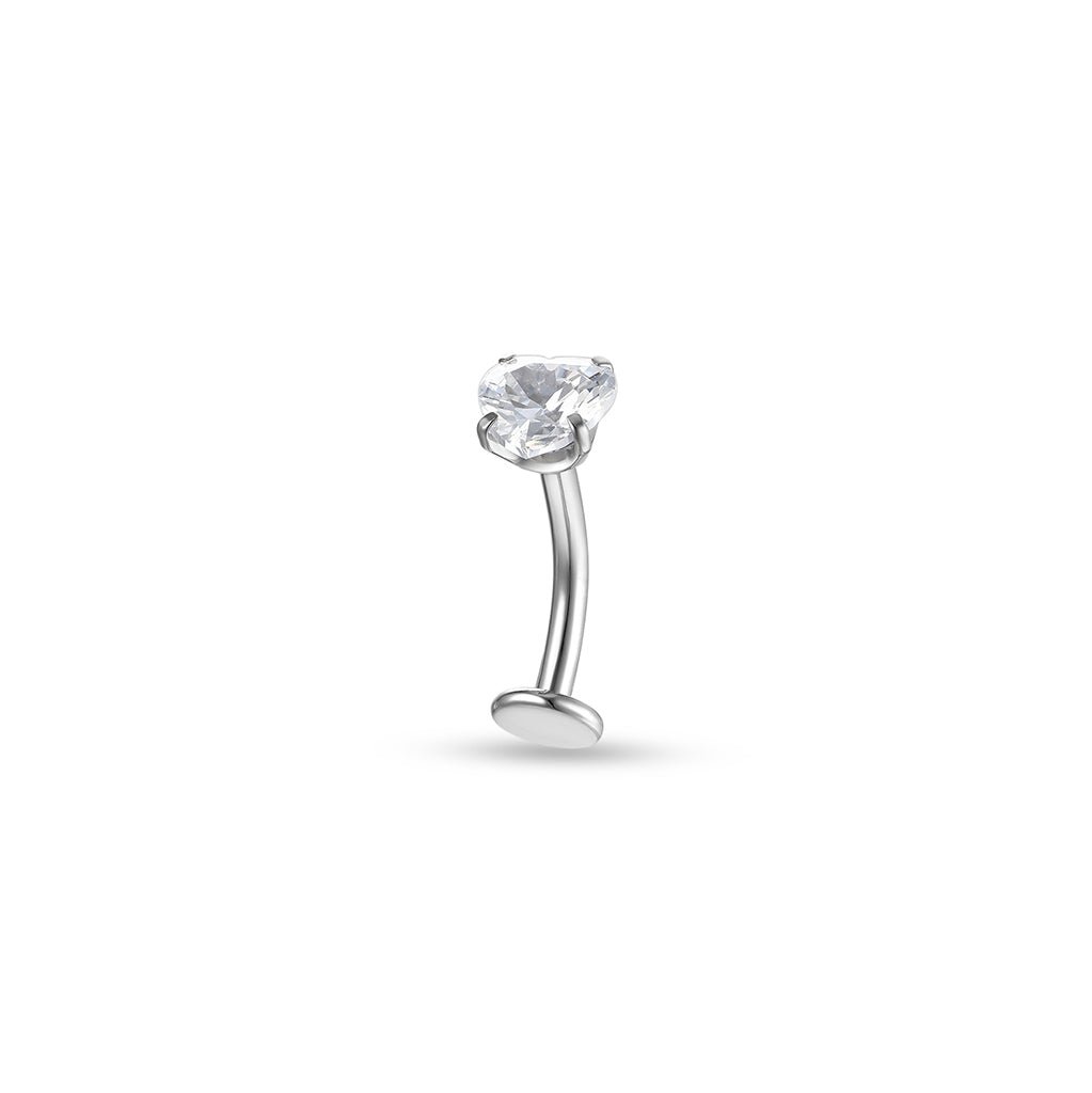 Implant-grade titanium floating navel bar with clear heart-shaped cubic zirconia in a claw setting, shown on a white background.