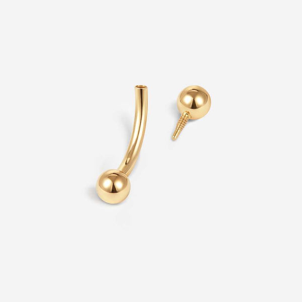 14K gold curved barbell disassembled to show its internally threaded ball end