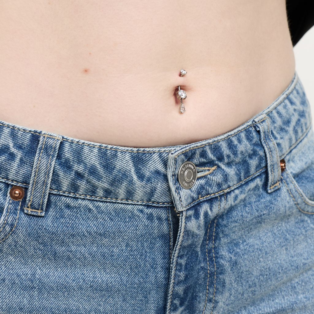 Titanium navel bar with round cubic zirconia dangle, small sparkle on barbell