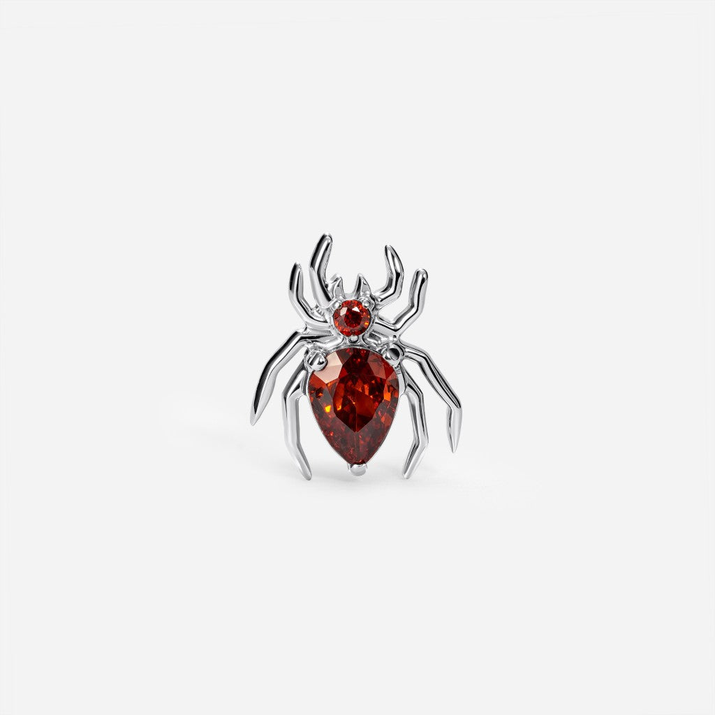 Titanium guided internally threaded spider top with a red cubic zirconia accent.
