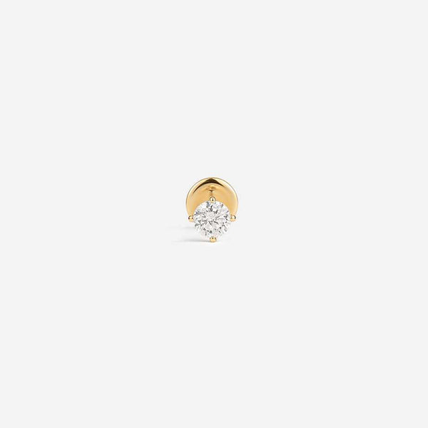 14K gold labret piercing with a round clear stone and flat disc back